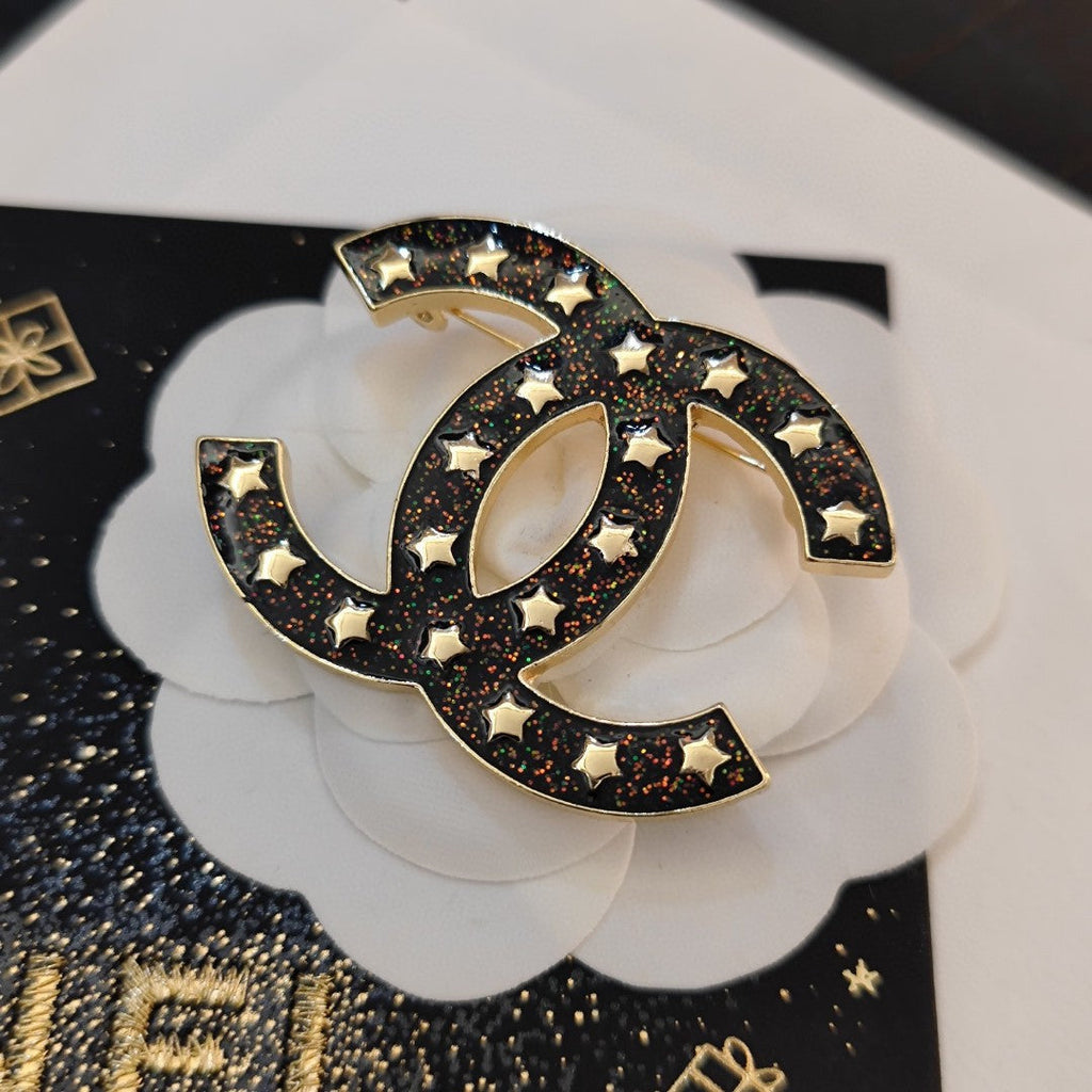18K  Chanel Black Star Brooch